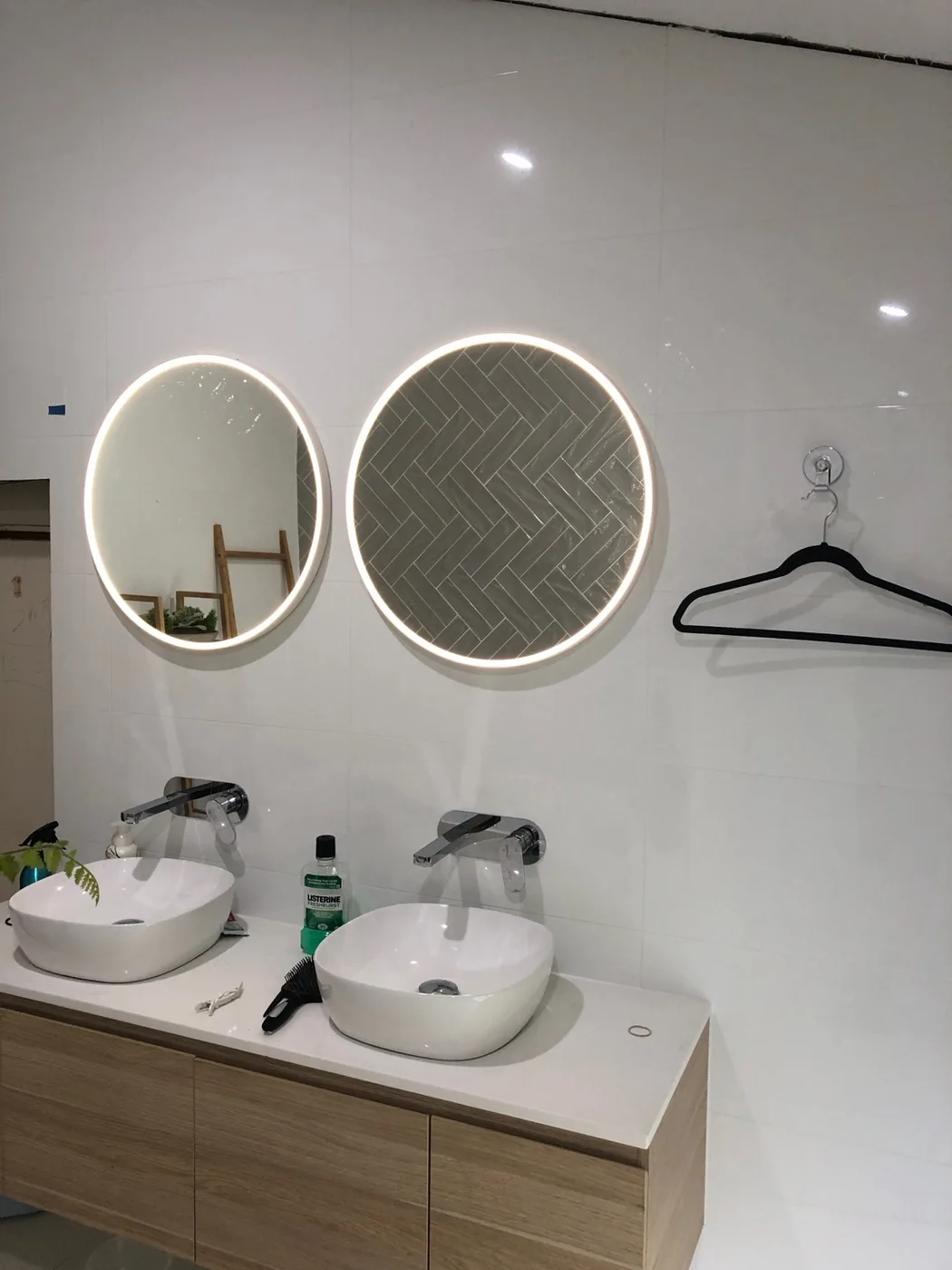 Illuminated bathroom mirror installation